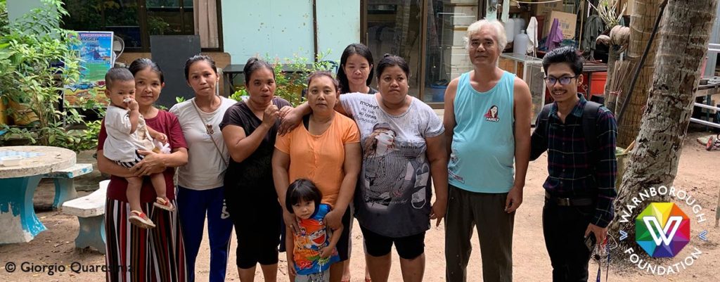 Raymond with Zaw Min Ton, the community's chief, and other villagers.